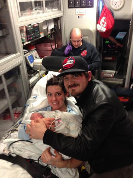 Meredith Andrew, her husband and newborn son enroute to the hosptial.